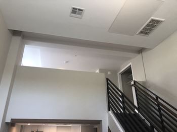 A view from the top of the stairs looking down into the stairwell